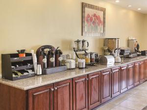 a kitchen with a counter with many appliances on it at La Quinta by Wyndham Mobile Satsuma / Saraland in Satsuma