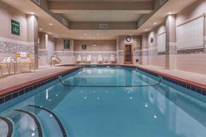 a large swimming pool in a hotel room at La Quinta by Wyndham Wichita Falls - MSU Area in Wichita Falls