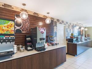 a fast food restaurant with a counter in a room at La Quinta by Wyndham Mathis in Mathis