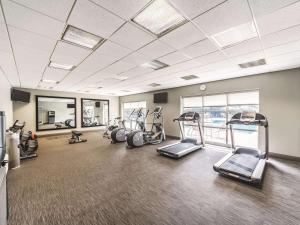 a gym with treadmills and ellipticals in a room at La Quinta Inn & Suites by Wyndham San Antonio Downtown in San Antonio