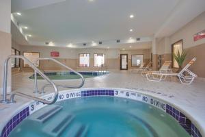 a pool in a hotel with a no diving tub at La Quinta by Wyndham Verona in Verona