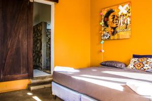 A bed or beds in a room at Casa Del Arte - rooms with private and shared bathrooms
