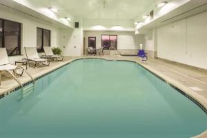 a large swimming pool with blue water in a building at La Quinta by Wyndham Mechanicsburg - Harrisburg in Mechanicsburg