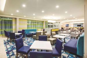 A restaurant or other place to eat at La Quinta by Wyndham Wichita Northeast