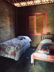 Llit o llits en una habitació de Chalé com Vista Privilegiada