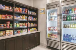 a grocery store with a refrigerator and lots of food at La Quinta by Wyndham Fort Worth West - I-30 in Fort Worth