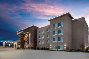 a rendering of a hotel with a building at La Quinta by Wyndham Owasso in Owasso