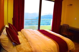 Postel nebo postele na pokoji v ubytování Hotel Nagarkot Inn