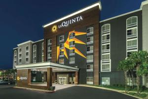 a large building with a clock on the front of it at La Quinta by Wyndham San Antonio Downtown in San Antonio
