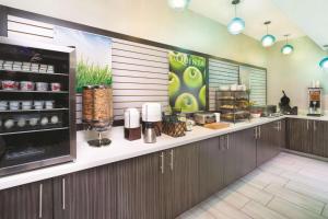 a kitchen with a counter with food on it at La Quinta by Wyndham Loudon in Loudon