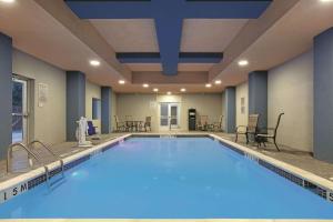 a large swimming pool in a hotel room at La Quinta by Wyndham Amarillo Airport in Amarillo