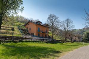 a house on the side of a hill at Villa dei Venti - Comfort Holiday in Bergamo