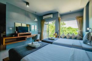 Gallery image of The Rubber Hotel - SHA Extra Plus in Thalang