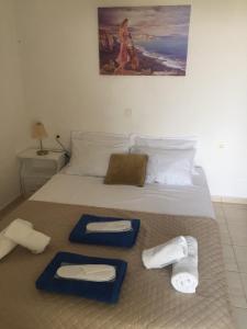Ein Bett oder Betten in einem Zimmer der Unterkunft Asimina