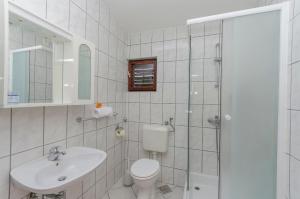 Kúpeľňa v ubytovaní Apartments Sklopina