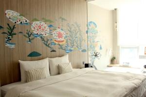 Voodi või voodid majutusasutuse Hotel Day Plus Teascape toas