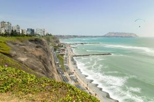 a view of the ocean and a beach at Hotel Lexus in Lima