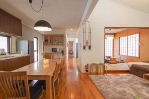 A kitchen or kitchenette at Pine House in ARAHA