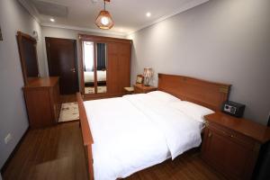 Letto o letti in una camera di Bokhtar Apart Hotel