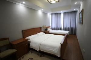 Postel nebo postele na pokoji v ubytování Bokhtar Apart Hotel + 24 fotografií