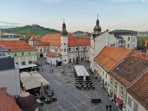 an overhead view of a city with buildings and tables at Modern studio in the heart of the city in Maribor
