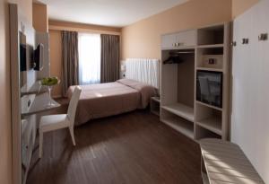 Posteľ alebo postele v izbe v ubytovaní Hotel Enrichetta