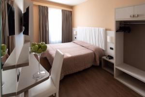 Posteľ alebo postele v izbe v ubytovaní Hotel Enrichetta