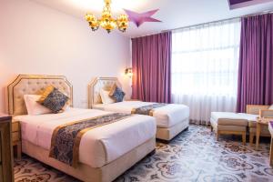 Postel nebo postele na pokoji v ubytování Hotel Hilal + 37 fotografií