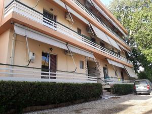 a car parked in front of a building at Villa Artemida in Selianitika