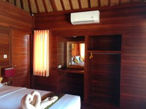 Postel nebo postele na pokoji v ubytování Svaha Nusa Guest House + 54 fotografií