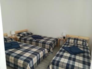 Posteľ alebo postele v izbe v ubytovaní Case degli Avi, camere nel Borgo marinaro