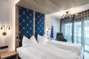 Letto o letti in una camera di Luis & die Buabm - Gasthof Jenesien