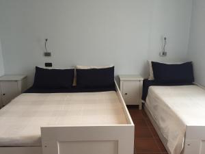 Łóżko lub łóżka w pokoju w obiekcie Agriturismo La Farazzina