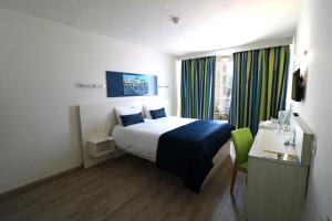 Postel nebo postele na pokoji v ubytování Hotel Santana