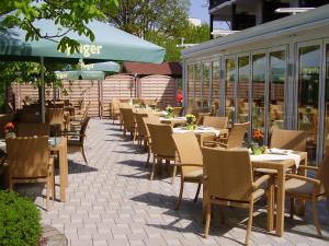 a row of tables and chairs at a restaurant at Hotel St. Georg in Bad Aibling +43 photos