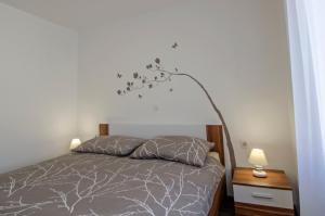 A bed or beds in a room at Apartment Pula R&D