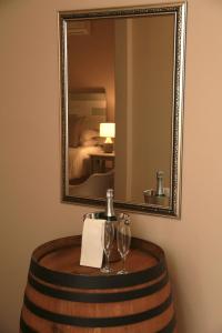 a table with wine glasses and a mirror at The Vine in Klawer +48 photos