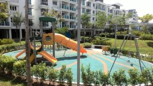 a playground at a apartment complex with a slide at Homestay de Putra in Kajang