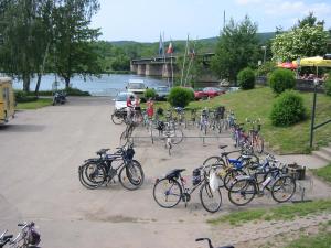 a bunch of bikes parked in a parking lot at Gästezimmer auf dem Campingplatz Konz in Konz