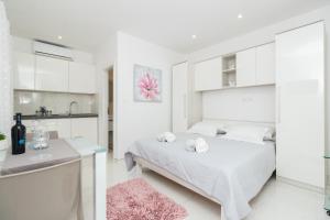 Postel nebo postele na pokoji v ubytování Apartments D&A