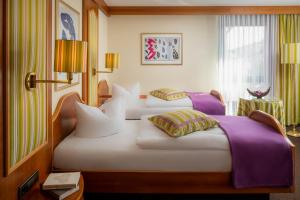 Letto o letti in una camera di Hetzel Hotel Stuttgart