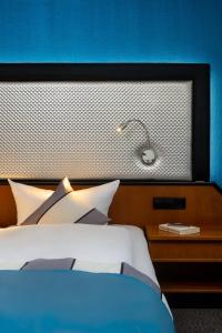 Letto o letti in una camera di Hetzel Hotel Stuttgart
