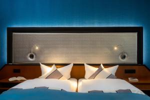 Letto o letti in una camera di Hetzel Hotel Stuttgart