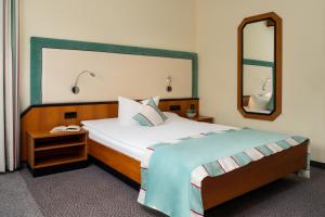 Letto o letti in una camera di Hetzel Hotel Stuttgart