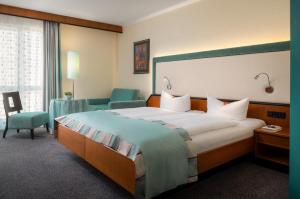 Letto o letti in una camera di Hetzel Hotel Stuttgart