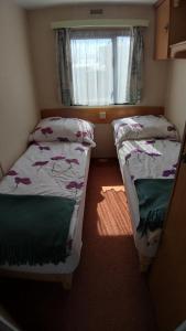 A bed or beds in a room at Cichy Zakątek