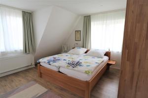 Tempat tidur dalam kamar di Am Deich 51