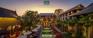 an overhead view of a building with tables and umbrellas at Chala Number6 in Chiang Mai