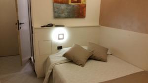 Voodi või voodid majutusasutuse Albergo Al Cacciatore toas