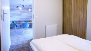 Posteľ alebo postele v izbe v ubytovaní Apartamenty Krynica No.1